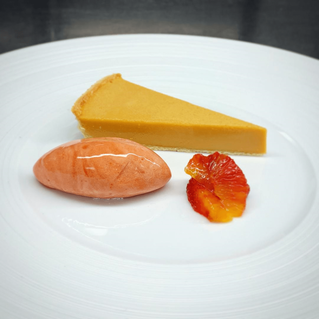 Butterscotch tart, plum & anise sorbet, blood orange