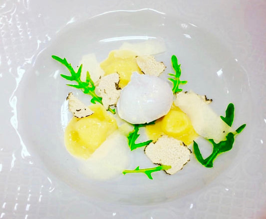 Parmigiano Ravioli with poached egg and white truffles